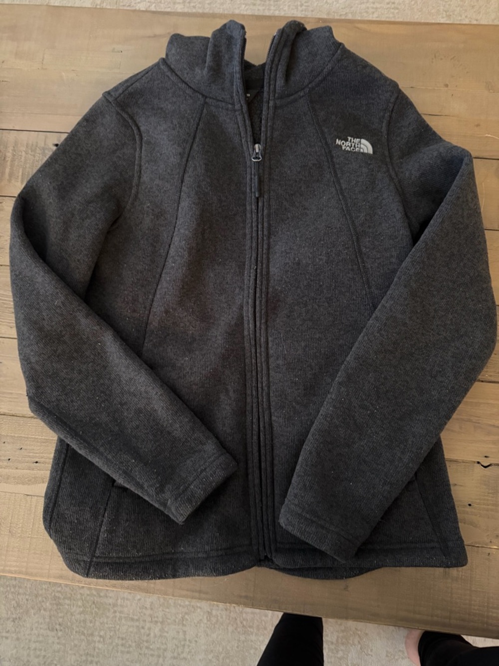 The North Face Women’s Charcoal Fleece Jacket with hood.